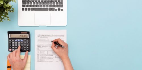 Tax income concept. Accountant filling form