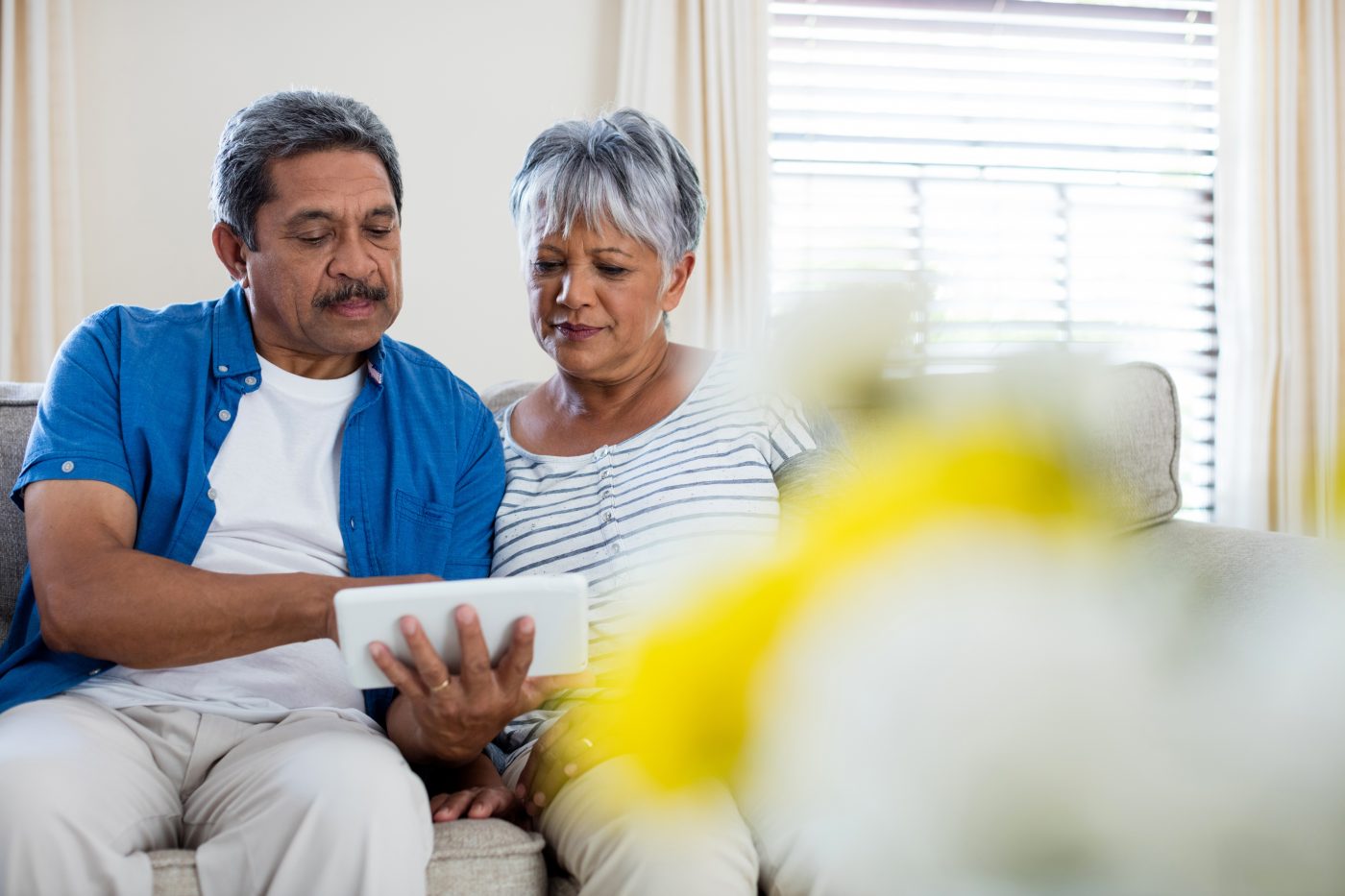 Senior couple using digital tablet